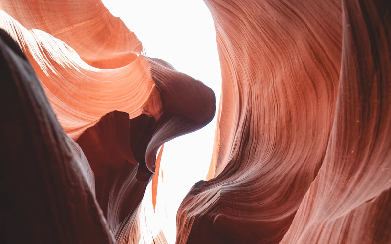 Wavy red sandstone walls inside Antelope Canyon